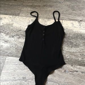 black buttoned body suit
